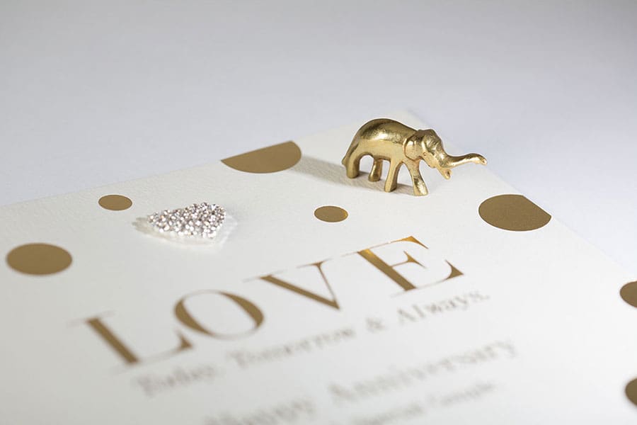 hot foil printed gold card with small gold elephant