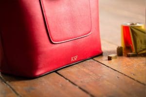 Red handbag with personalised hot foil gold initials 'KSF'