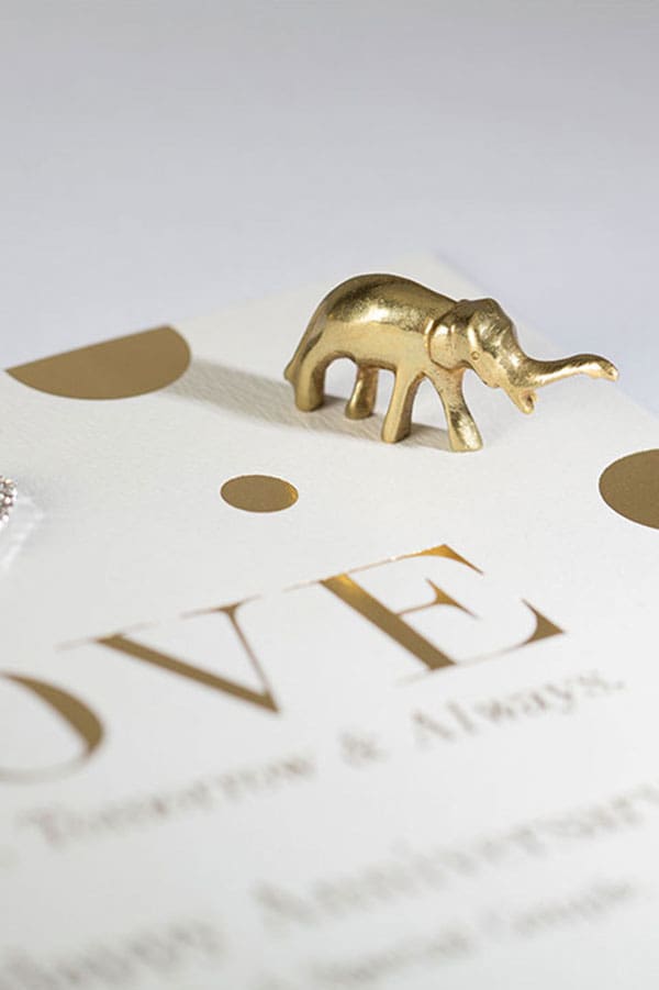 hot foil printed gold card with small gold elephant