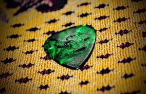 Hot foiled green guitar plectrum