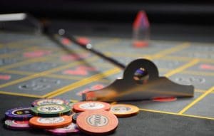 Hot foiled poker chips on a poker board
