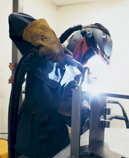 Welding a press frame in the Metallic Elephant workshop